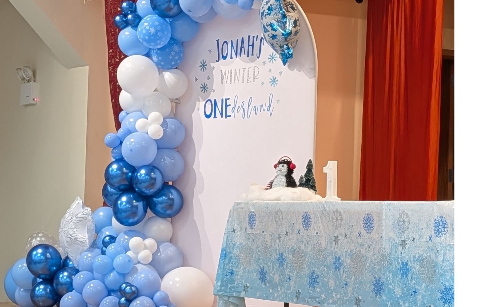 Winter "One"derland Themed Party backdrop balloons and decor at a Church in Brooklyn